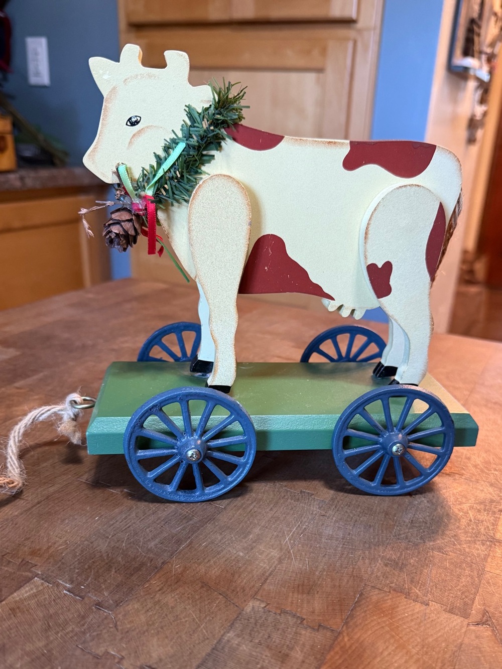 Enesco Cream & Brown Pull-Along Folk Art Cow on Green Base with Blue Wheels